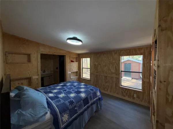 a bathroom with a sink a mirror and shower curtain