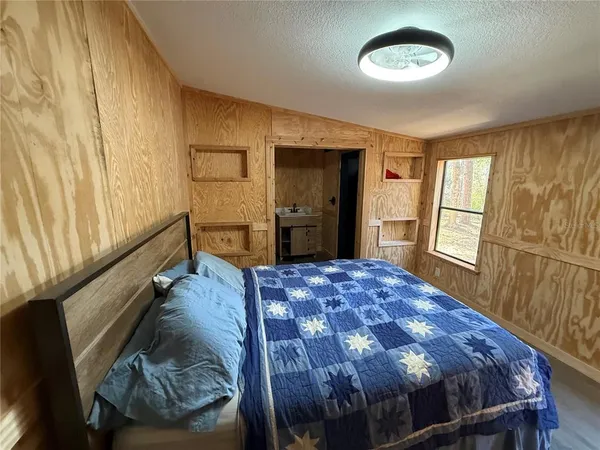 a bathroom with a toilet and a shower curtain