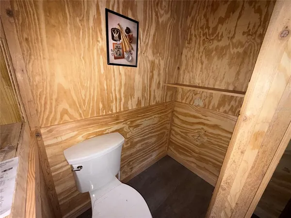 a bathroom with a glass shower door