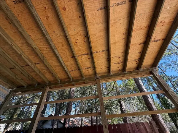 a view of a patio with a table chairs and a fireplace