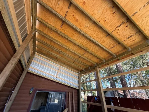 a view of a terrace with furniture and a lake view