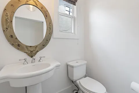 a view of a backyard with wooden fence