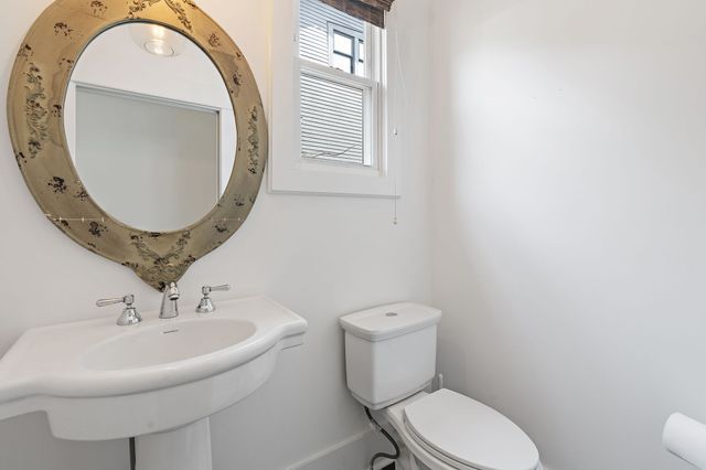 a view of a backyard with wooden fence