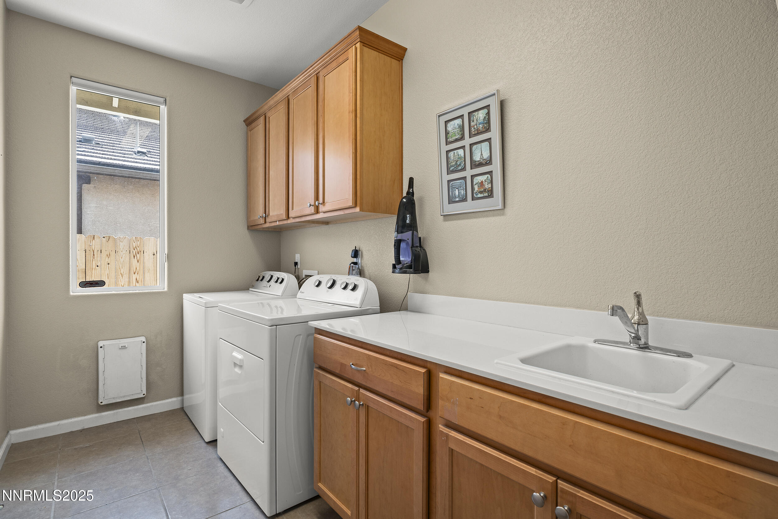 2280 Hyperion Lane Reno, NV 89521 - Photo 24 of 48 a utility room with a sink a washer and dryer