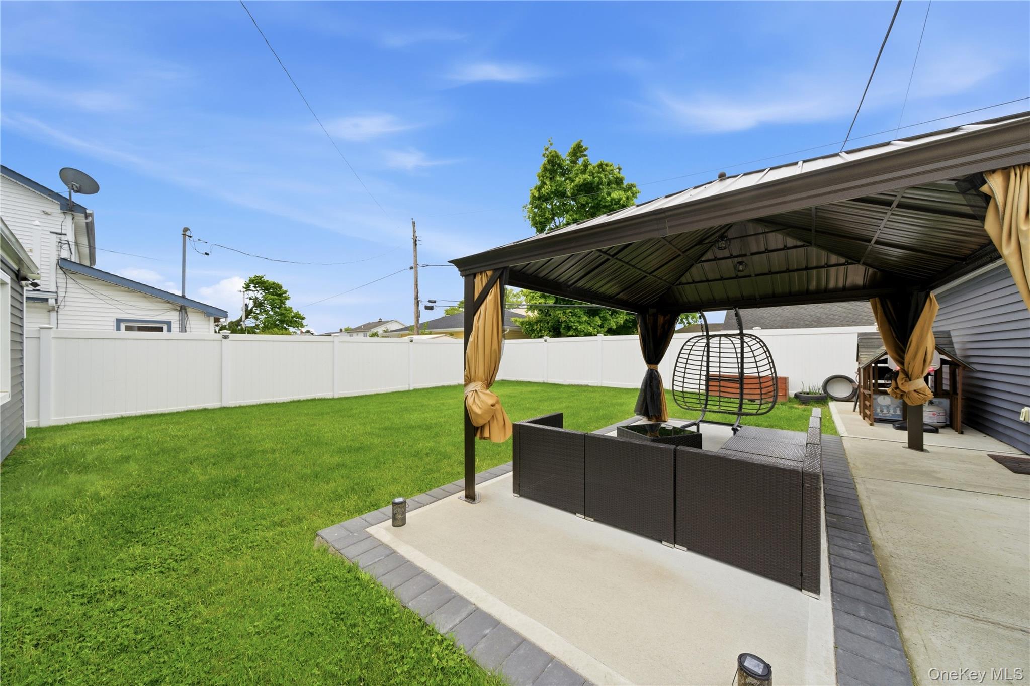50 Ridge Lane Levittown, NY 11756 - Photo 27 of 27 a view of a backyard with sitting area