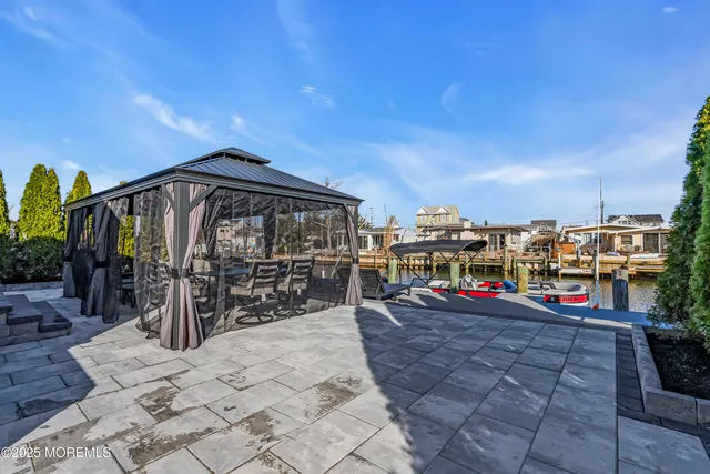 a spacious bedroom with a bed and a fireplace