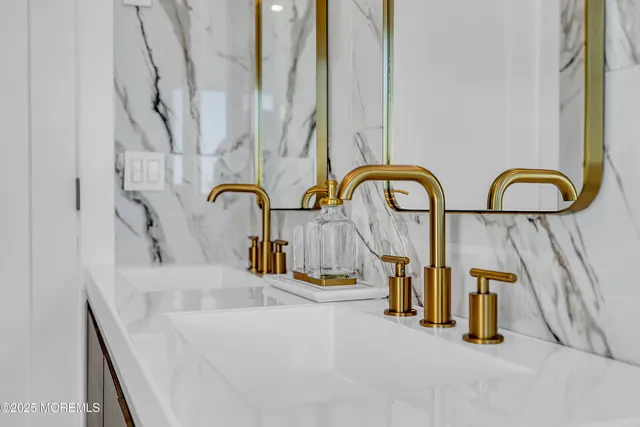 a dining room with furniture a fireplace and wooden floor