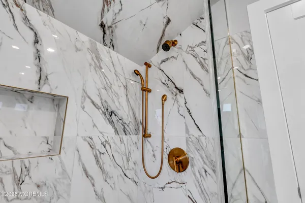 a dining room with furniture a fireplace and wooden floor