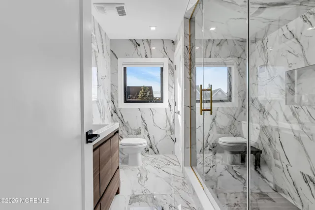 a kitchen with stainless steel appliances granite countertop a sink and a stove