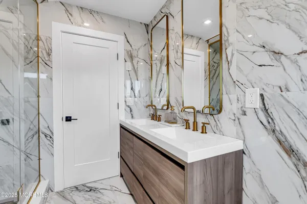 a kitchen with stainless steel appliances granite countertop a sink and a stove