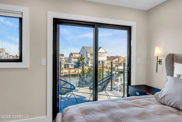 a view of a roof deck with couches and pool
