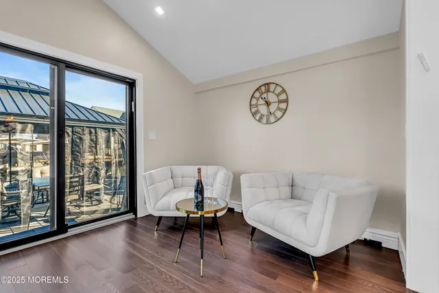 a bed room with a bed and painting on the wall