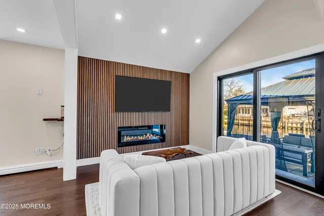 a work room with furniture and a large window