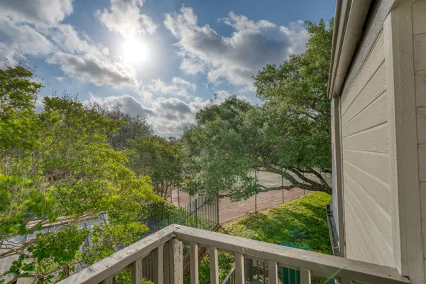 a view of a balcony with an outdoor space