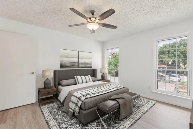 a bedroom with a large bed and a window