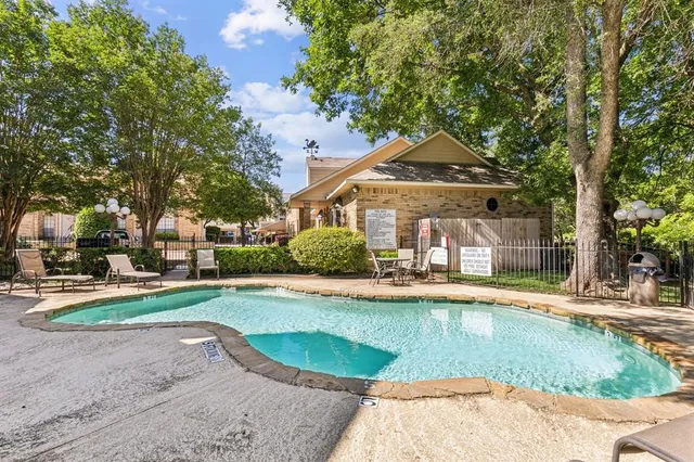 a view of a house with a yard and plants