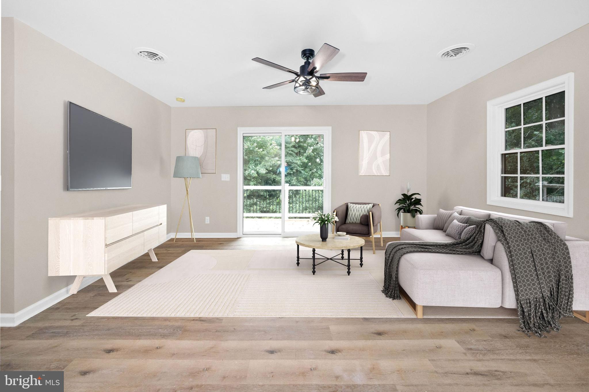 834 Willow Grove Road Felton, DE 19943 - Photo 12 of 48 a living room with furniture and a large window