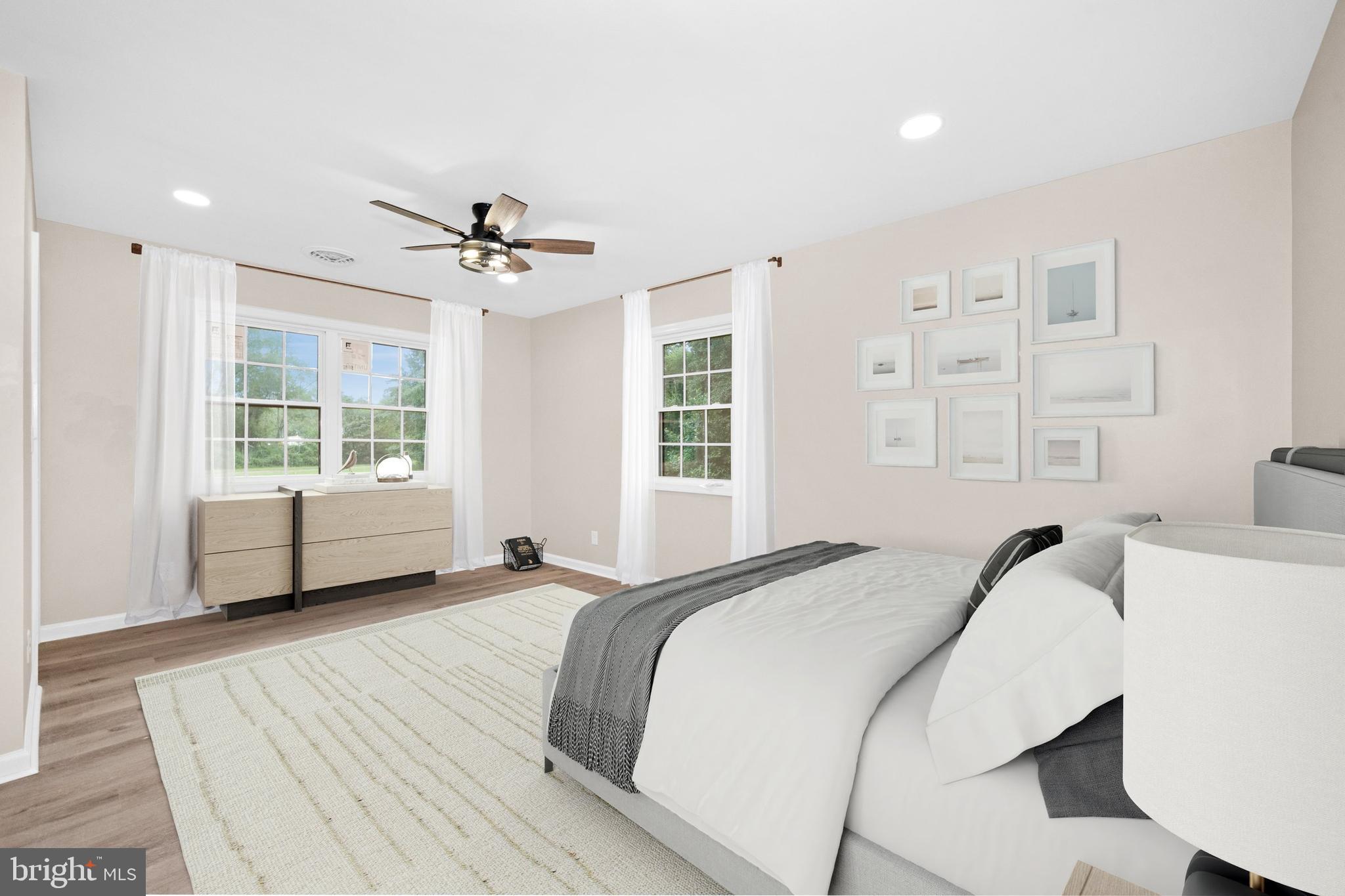 834 Willow Grove Road Felton, DE 19943 - Photo 16 of 48 a spacious bedroom with a bed and a window