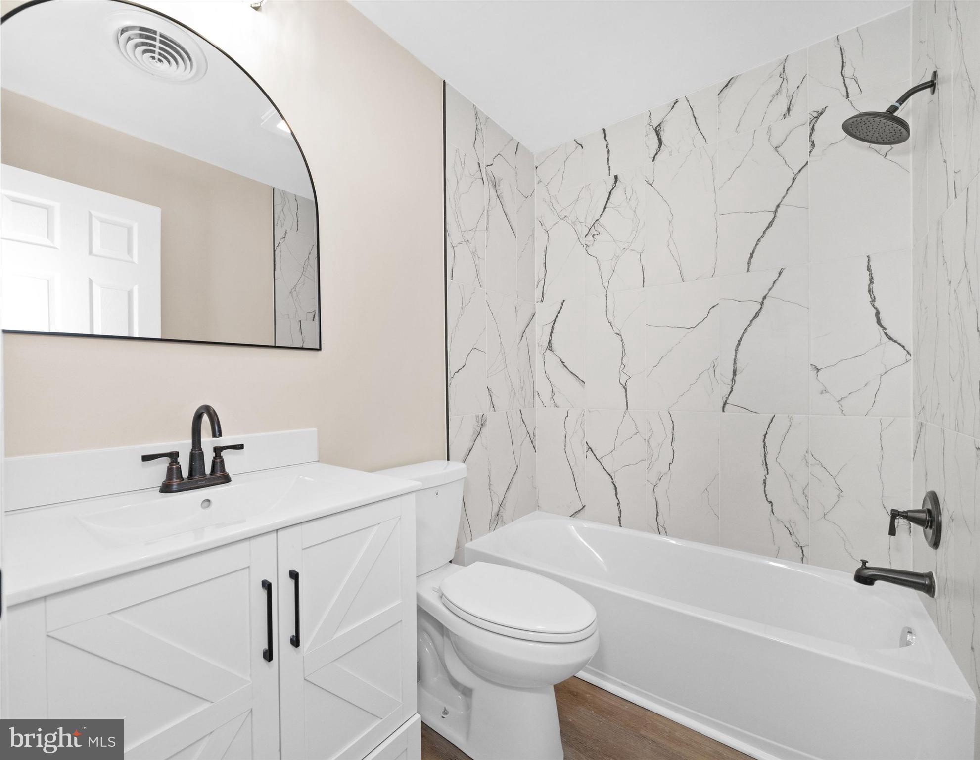 834 Willow Grove Road Felton, DE 19943 - Photo 24 of 48 a bathroom with a sink a toilet and a bathtub