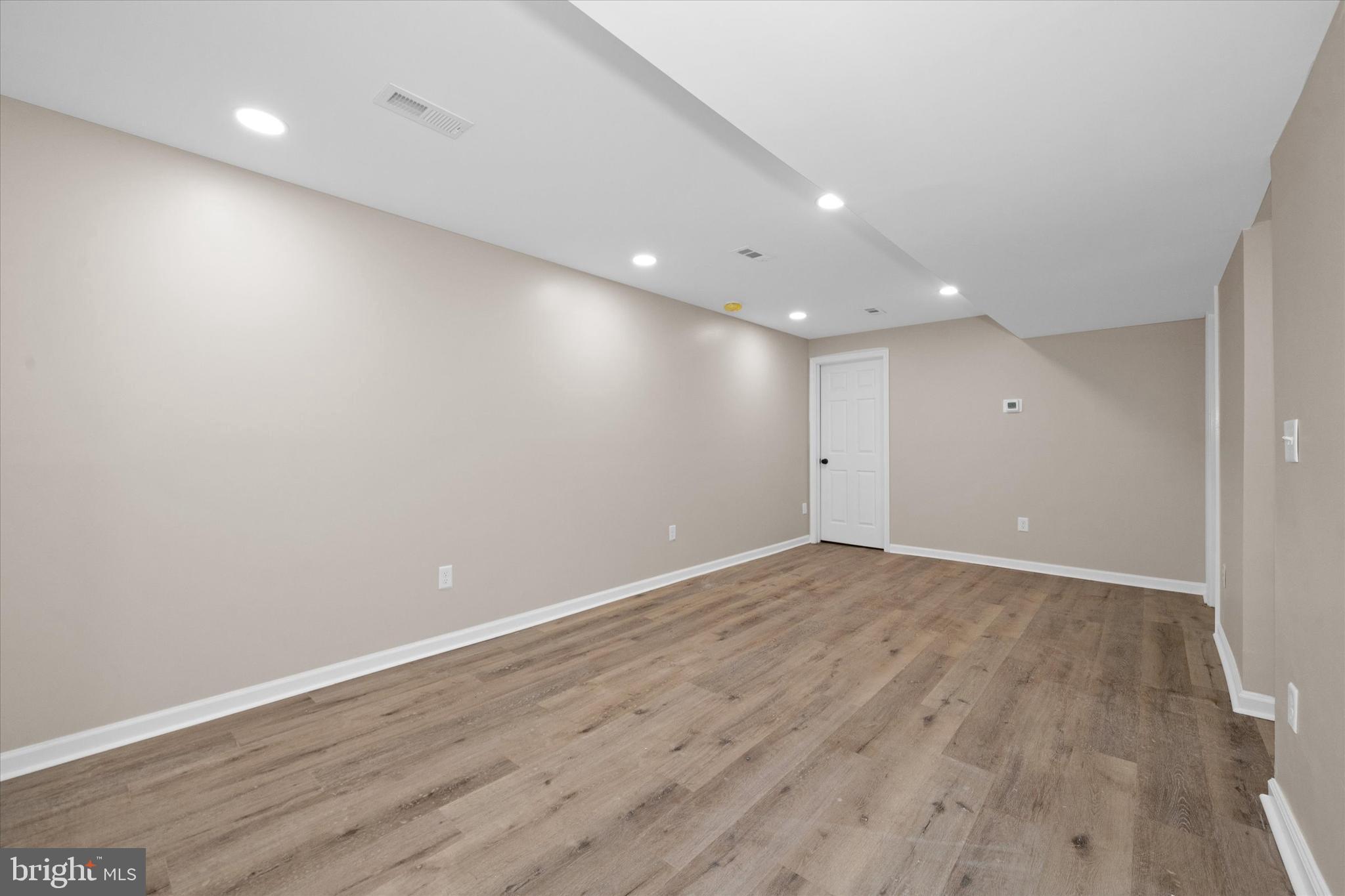 834 Willow Grove Road Felton, DE 19943 - Photo 26 of 48 a view of an empty room with wooden floor