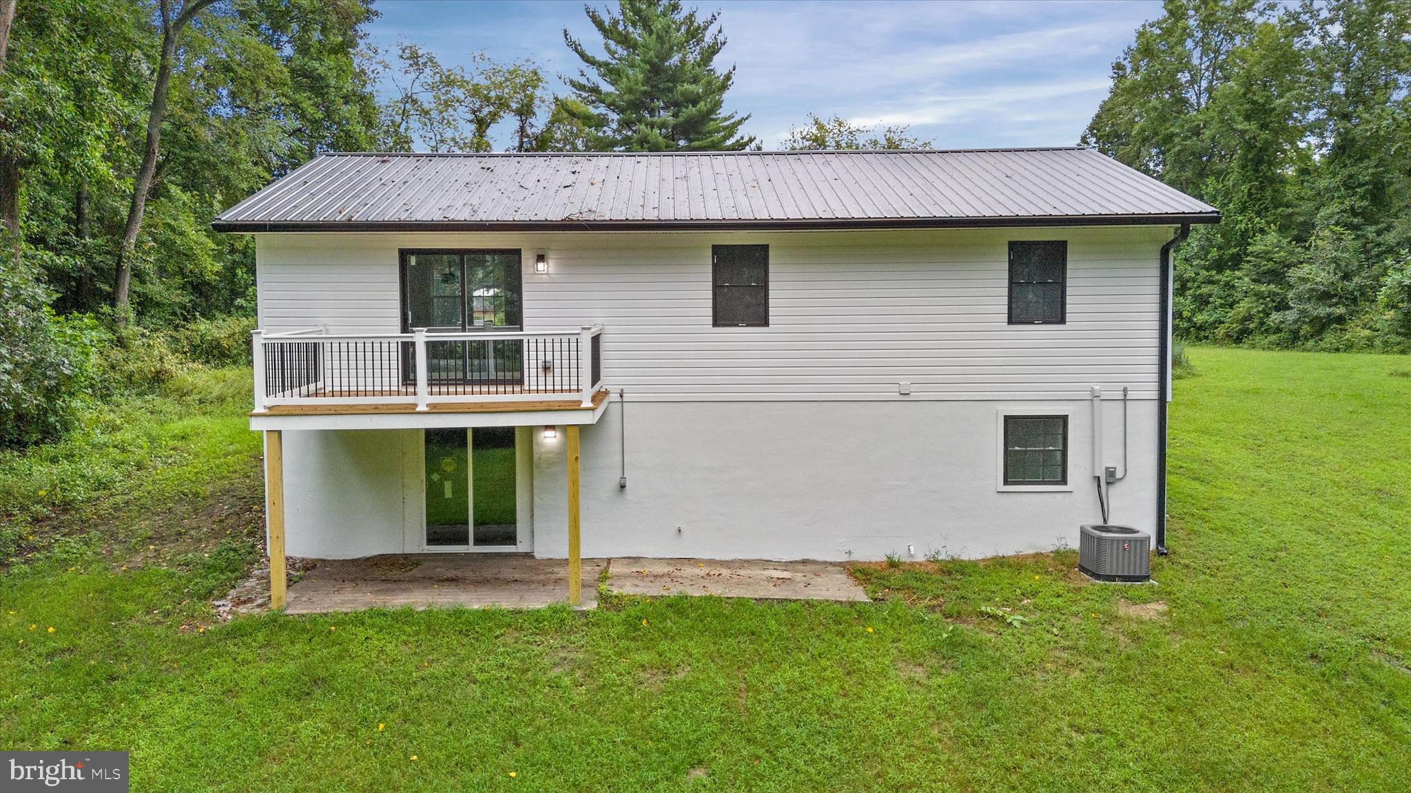 834 Willow Grove Road Felton, DE 19943 - Photo 42 of 48 a view of a house with a backyard
