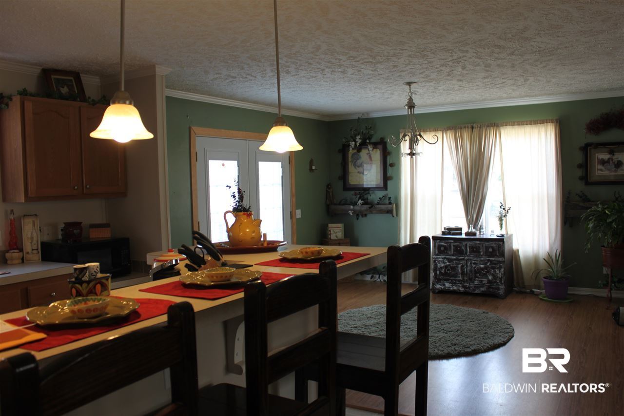 9380 Spice Pond Road Eight Mile, AL 36613 - Photo 23 of 36 Pendant lighting, SS dishwasher & stove.