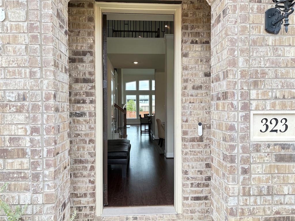323 Butternut Way Irving, TX 75063 - Photo 3 of 32 a hallway with a view of a bathroom