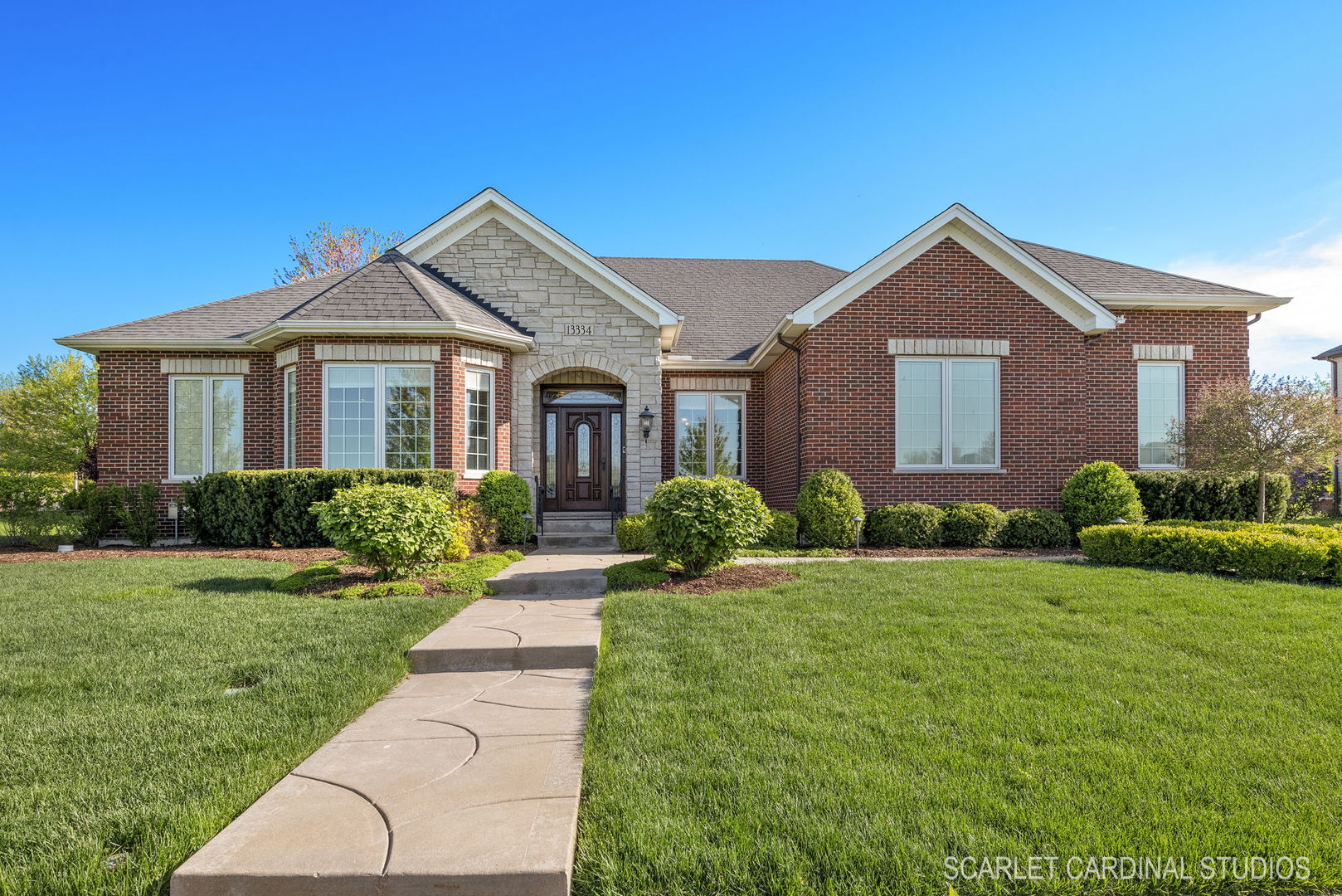 a front view of a house with a yard