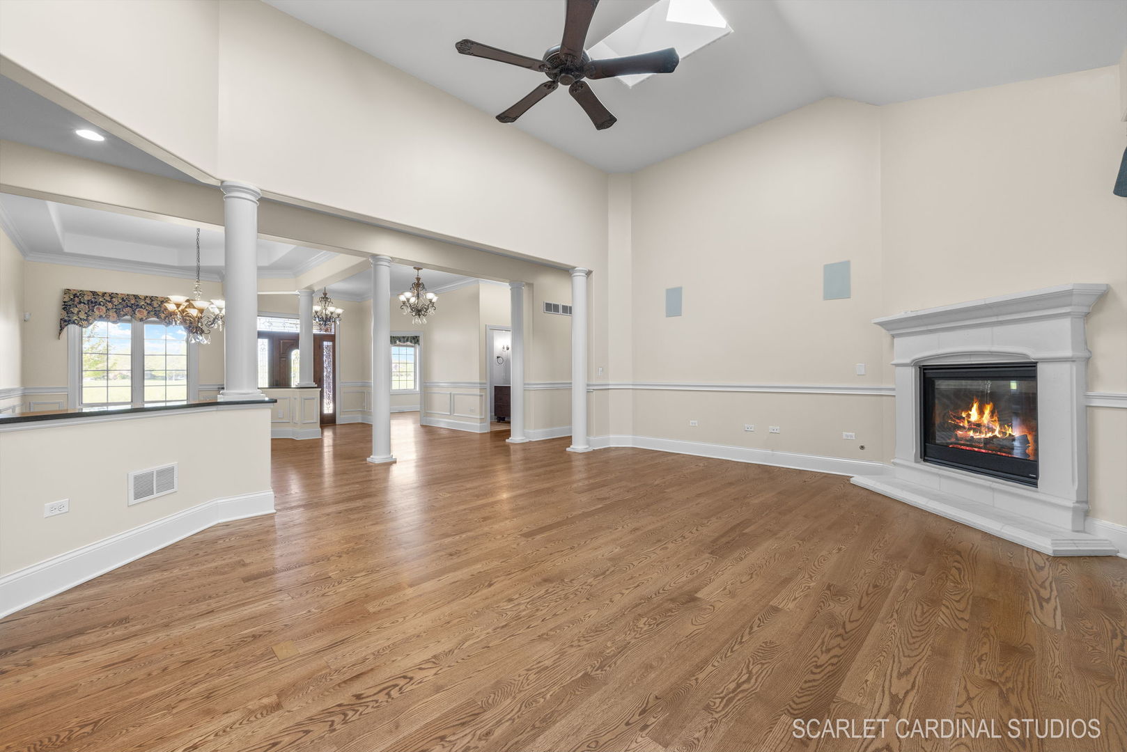 13334 Kerr Street Plainfield, IL 60585 - Photo 11 of 53 a view of an empty room with wooden floor fireplace and a window