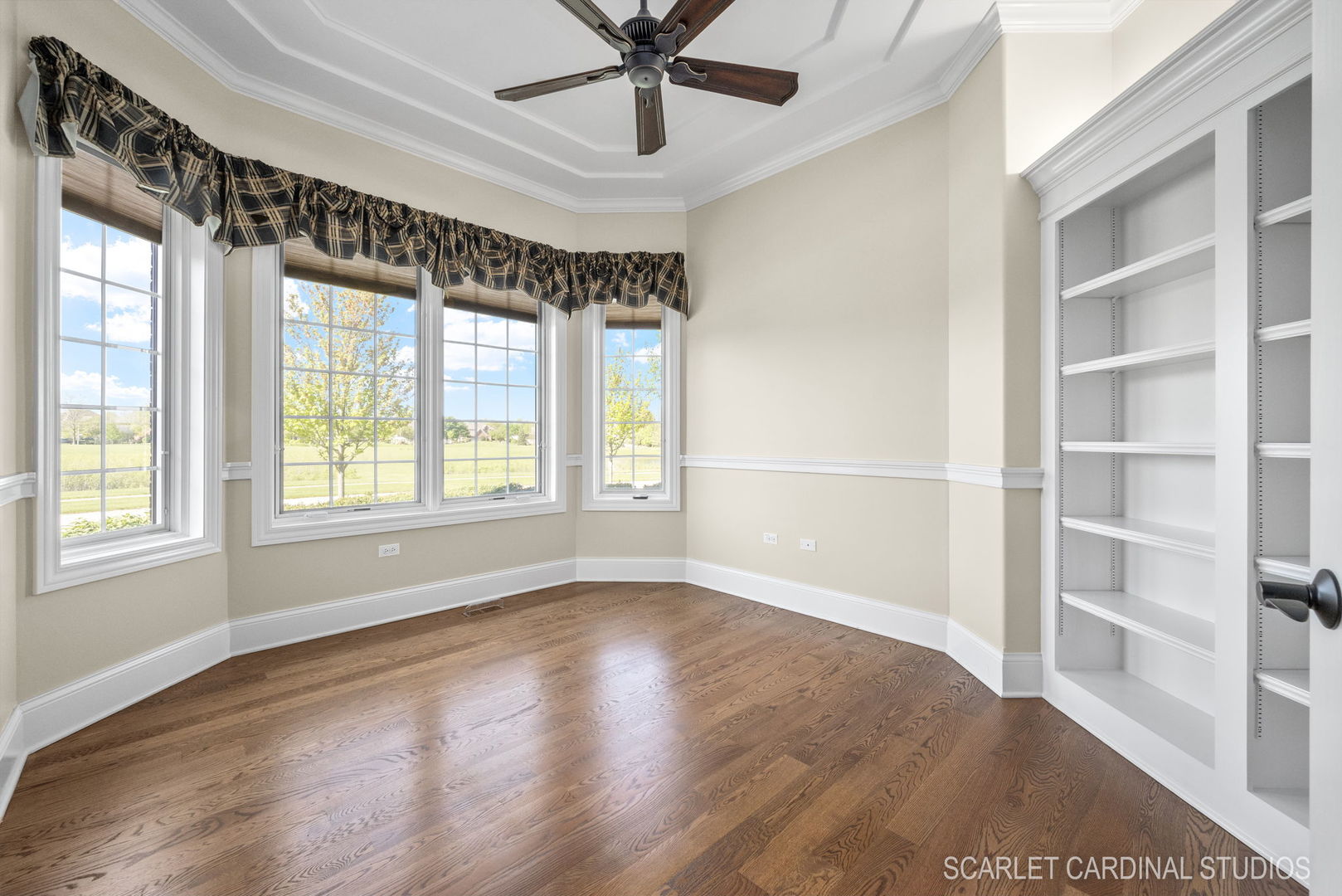 13334 Kerr Street Plainfield, IL 60585 - Photo 26 of 53 a view of an empty room with a window and wooden floor