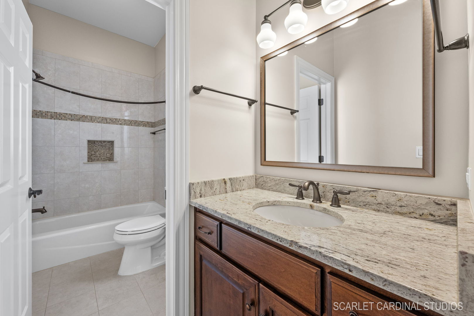 13334 Kerr Street Plainfield, IL 60585 - Photo 28 of 53 a bathroom with a granite countertop sink toilet and shower