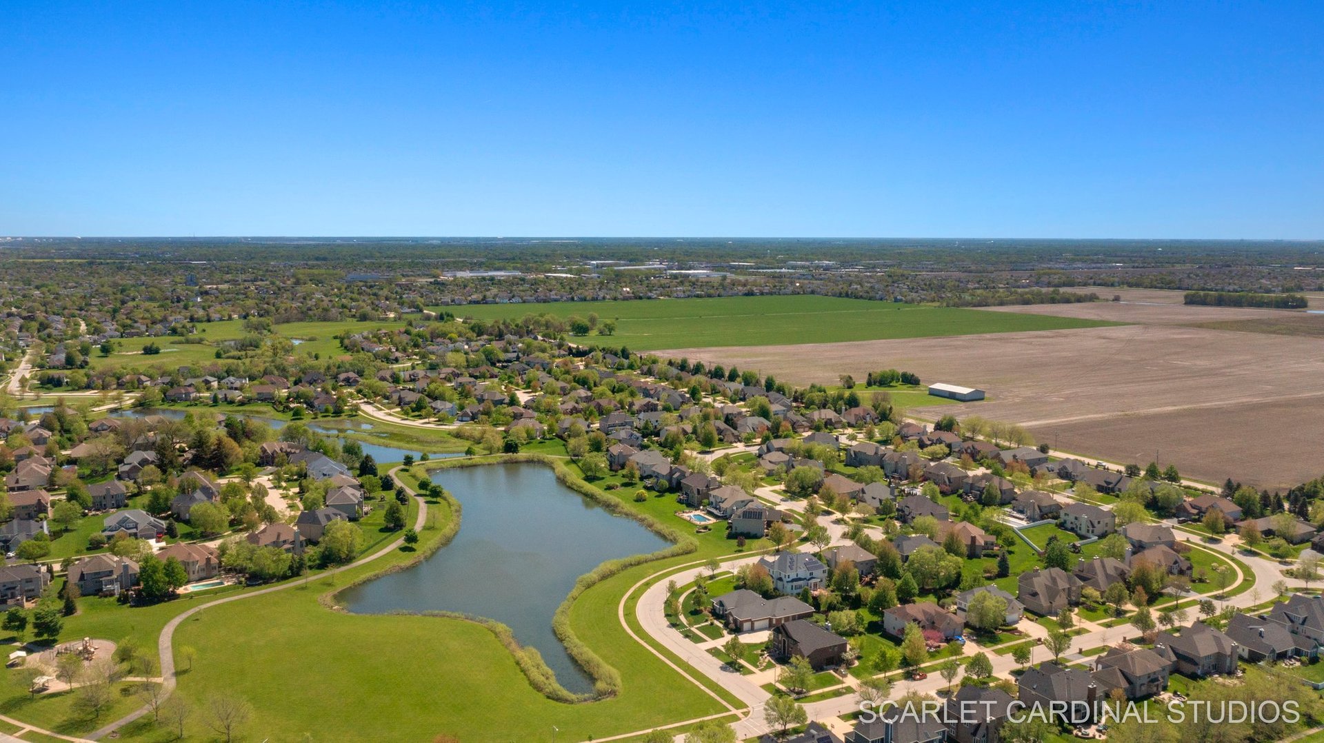 13334 Kerr Street Plainfield, IL 60585 - Photo 48 of 53 an aerial view of lake and residential houses with outdoor space