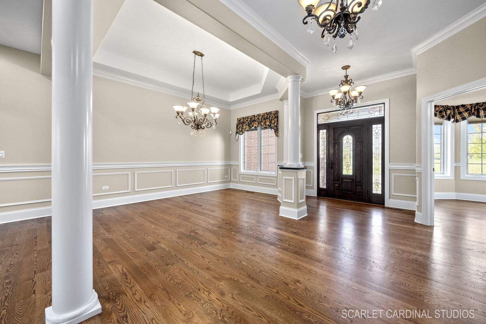 13334 Kerr Street Plainfield, IL 60585 - Photo 6 of 53 a view of a chandelier in a room with wooden floor and chandelier