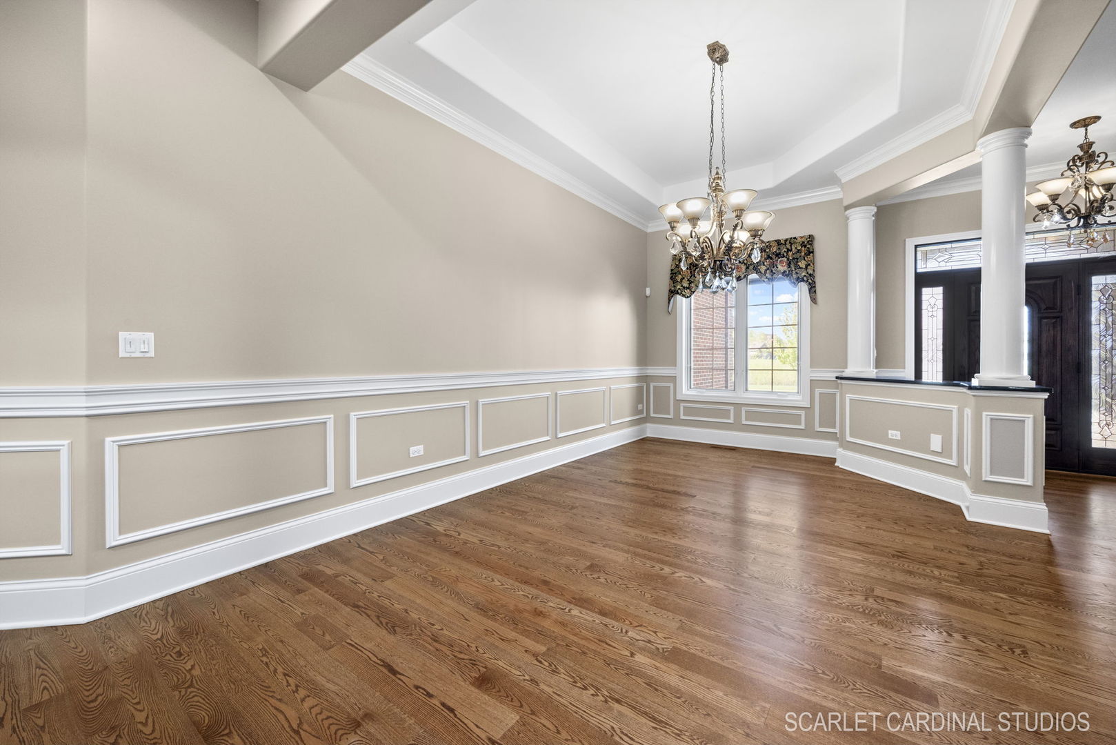 13334 Kerr Street Plainfield, IL 60585 - Photo 7 of 53 a view of a living room with wooden floor and chandelier