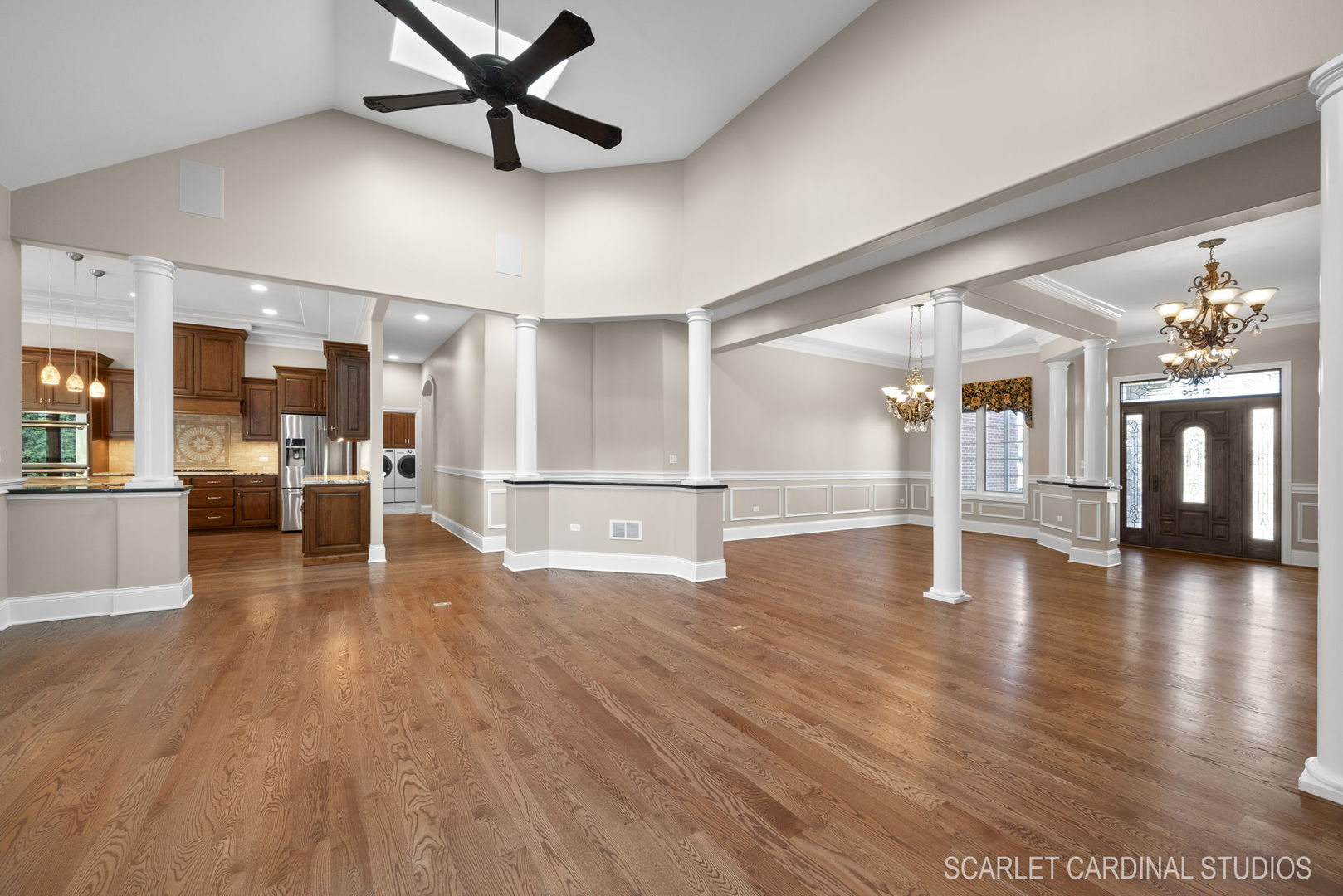 13334 Kerr Street Plainfield, IL 60585 - Photo 9 of 53 a view of a room with wooden floor and a kitchen