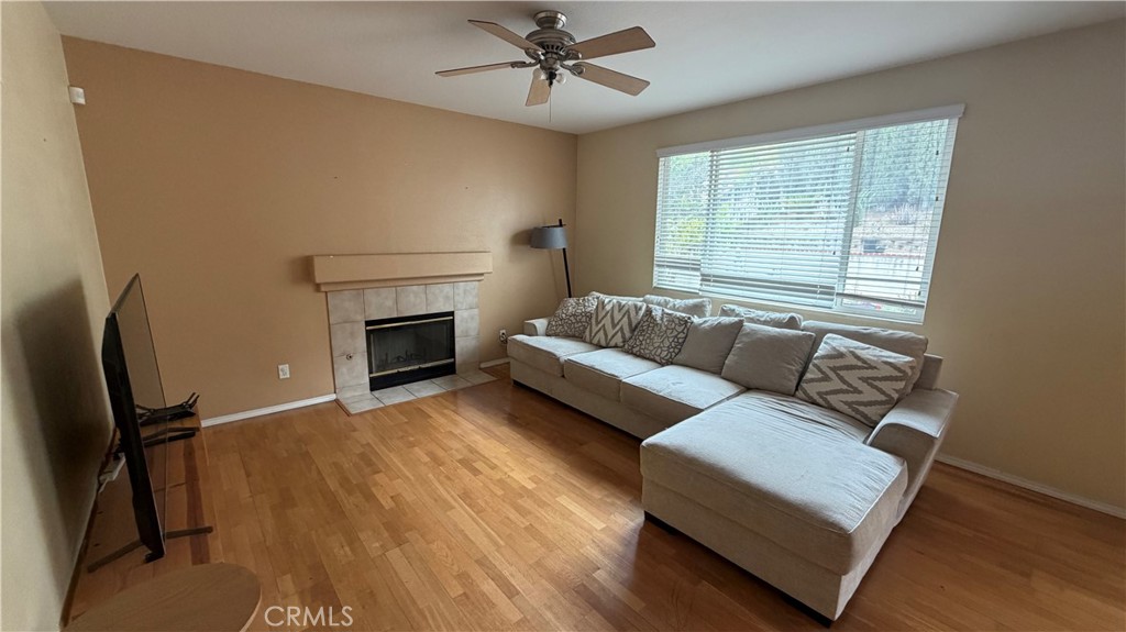 7134 Cumberland Place Rancho Cucamonga, CA 91739 - Photo 4 of 22 a living room with furniture and a fireplace