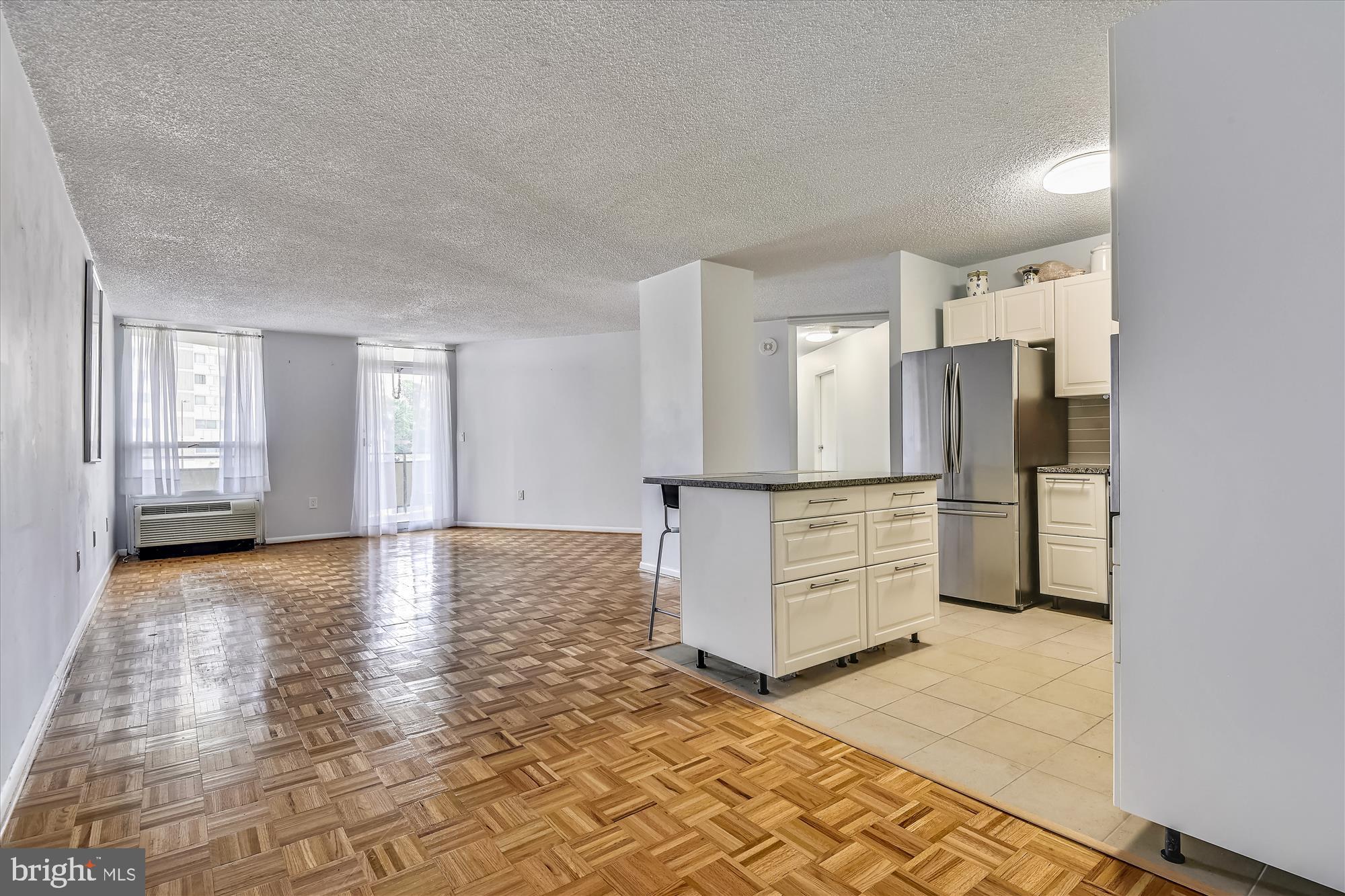 205 East Joppa Road, Unit 201 Towson, MD 21286 - Photo 10 of 37 Standing in the dining area, lovely parquet floors