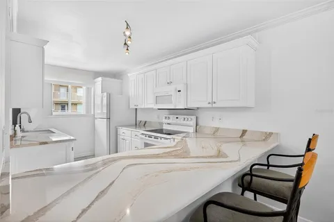 a living room with a sink furniture and a dresser