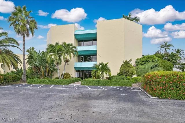 a view of a palm trees in front of a house