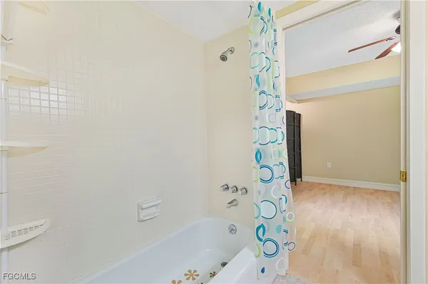 a bathroom with a bathtub and shower