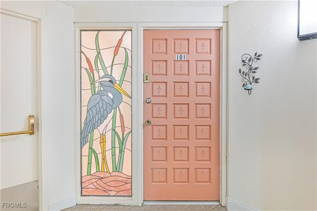 hallway with wooden floor and windows