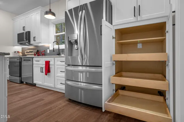 a kitchen with appliances and cabinets
