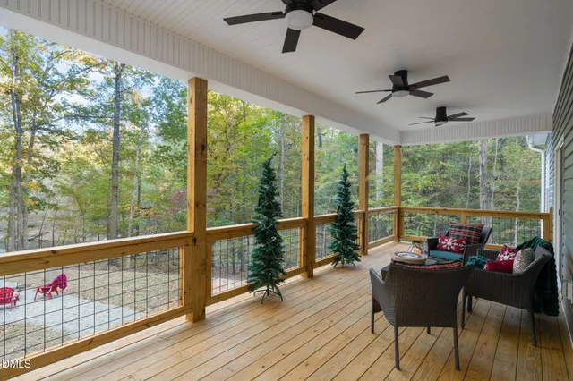a bed sitting in a spacious bedroom next to a window