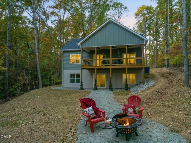 a backyard of a house with outdoor seating
