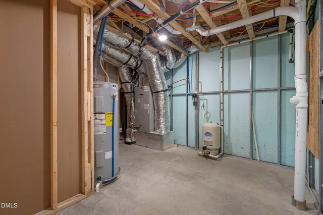 a view of a backyard with chairs and a fire pit