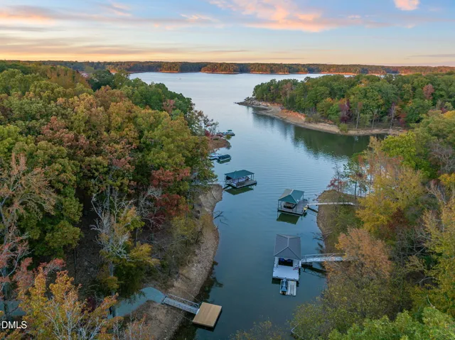 a view of a lake with a table and chairs