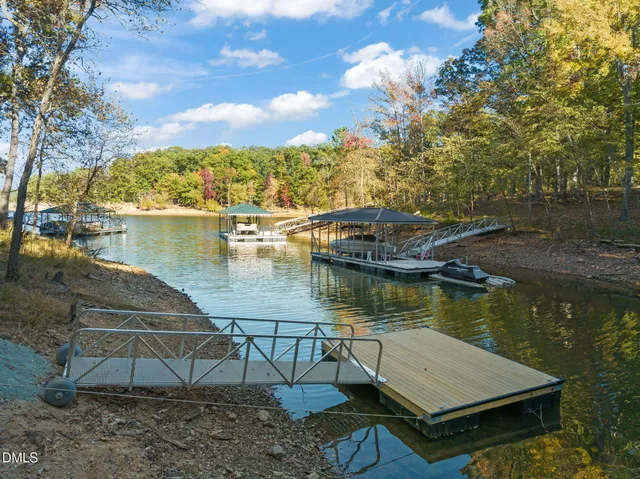 a view of a lake with a house in the background