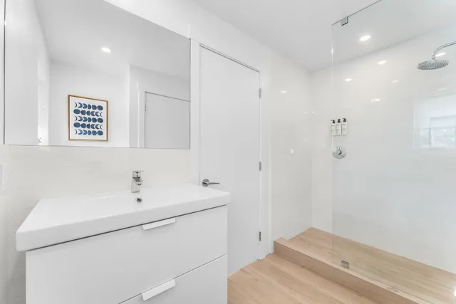 a balcony with furniture and a potted plant