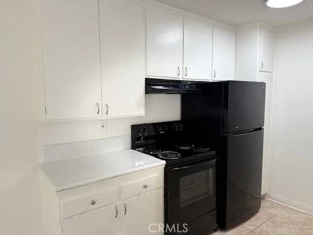 a kitchen with a sink and a counter top space