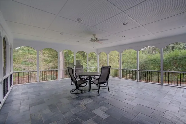 a view of a balcony with furniture